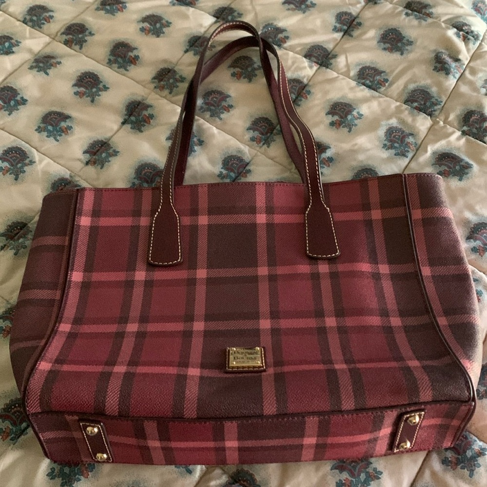 Dooney and Bourke Purse with a very nice color. With dust bag.